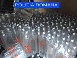 Contrabandişti de alcool săltaţi de mascaţi